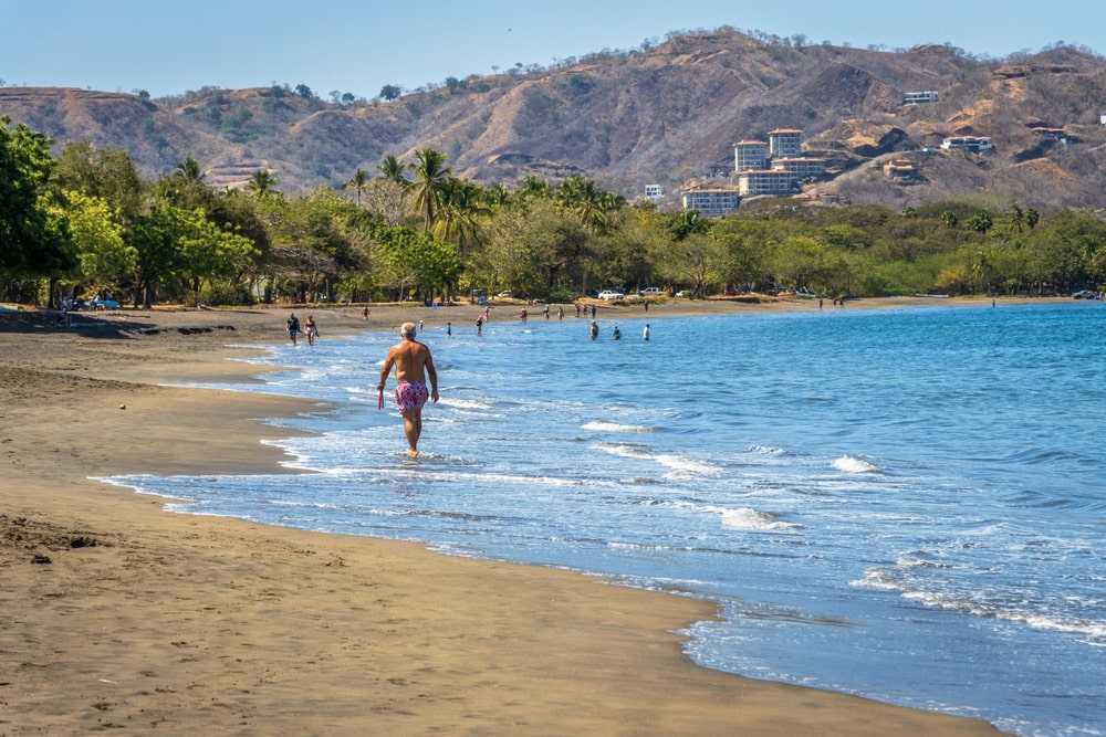 retired_gentleman_walking_along_the_beach_in_costa_rica